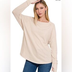 Beige long sleeve with thumb holes. Brand new with tags.